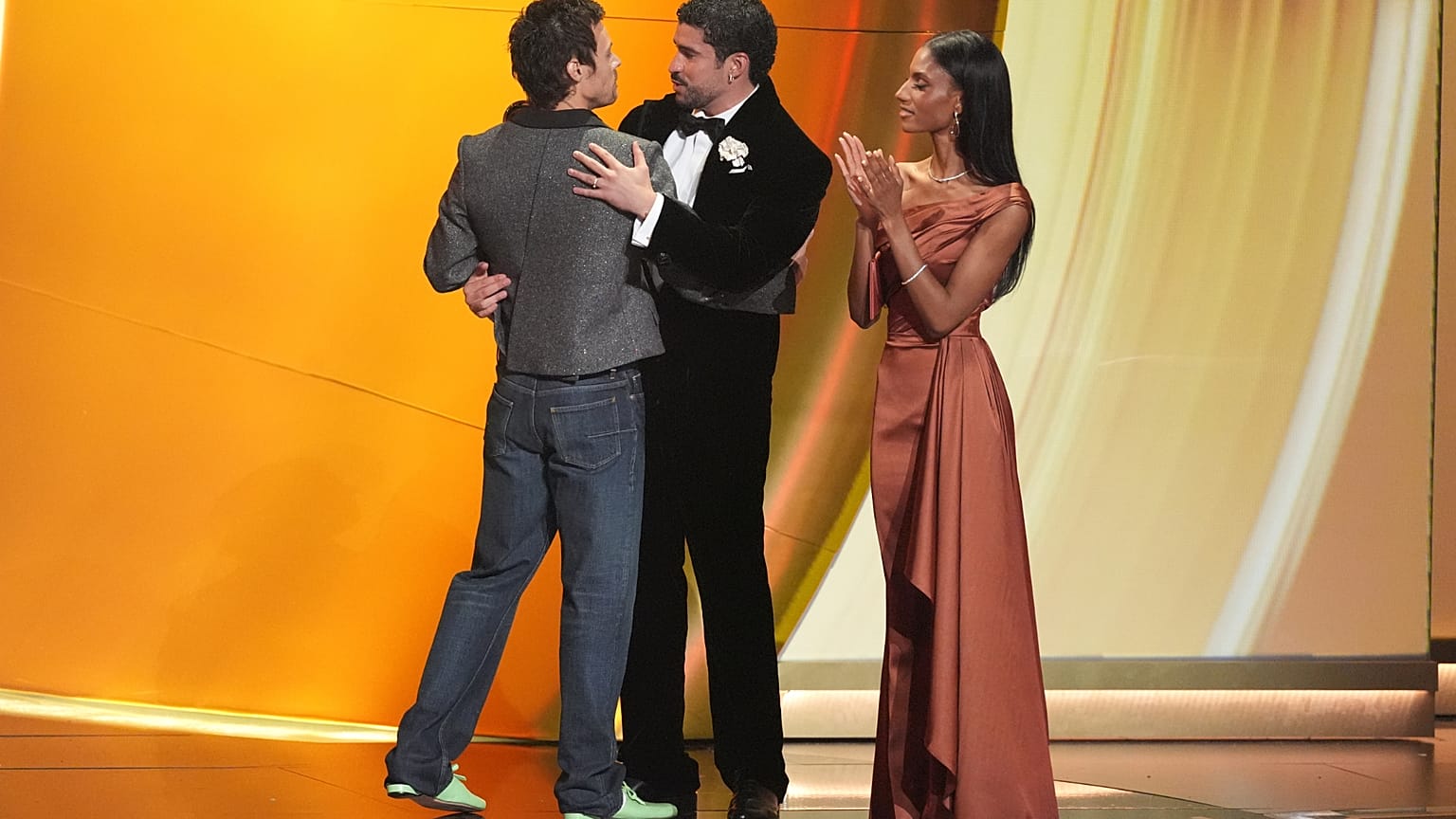 Harry Styles, left, presents the award for album of the year to Bad Bunny for "Debí Tirar Más Fotos" during the 68th annual Grammy Awards