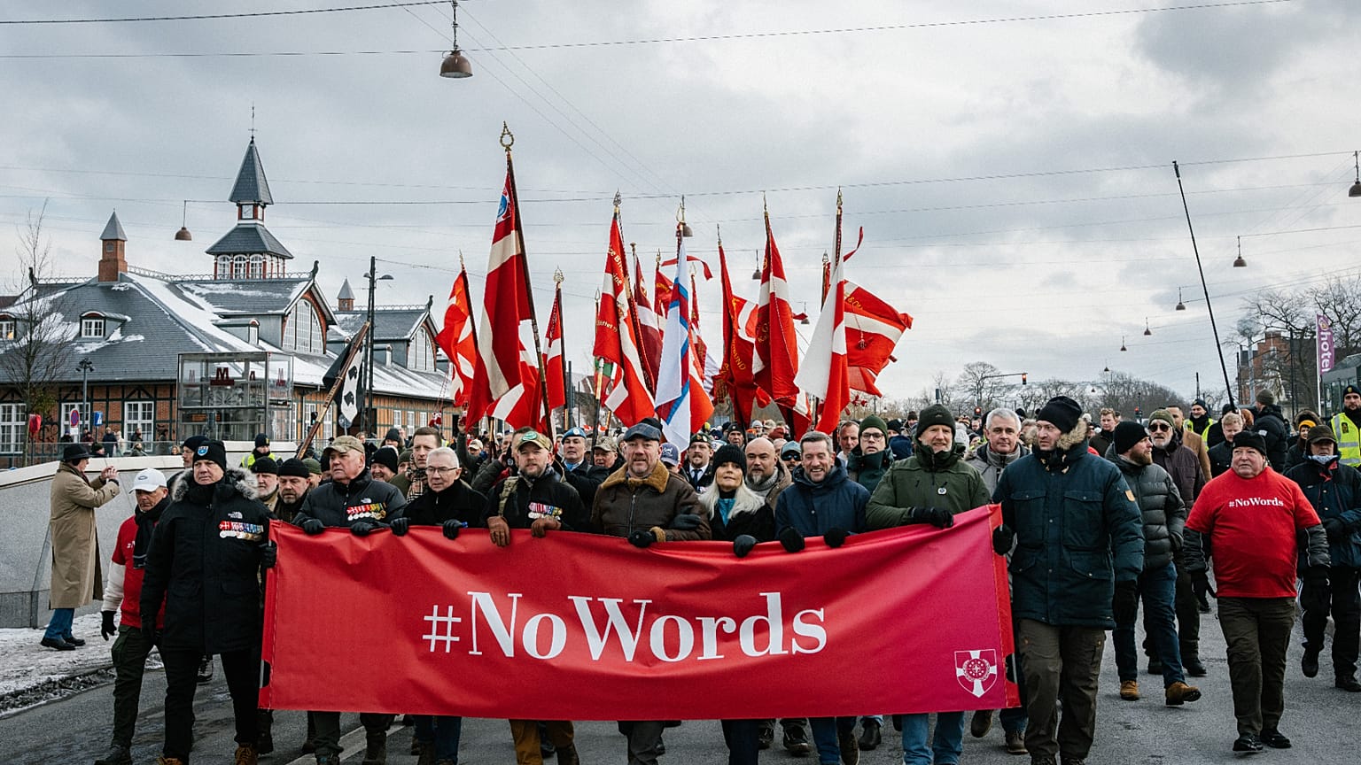 Hundreds of Danish veterans, many of whom fought alongside U.S. troops, stage a silent protest as they march from Kastellet to the American embassy in Copenhagen on Saturday, 