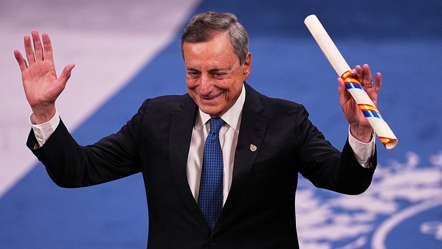Former Central Bank President Mario Draghi waves after receiving the Princess of Asturias Awards during a ceremony in Oviedo, northern Spain, Friday, Oct. 24, 2025