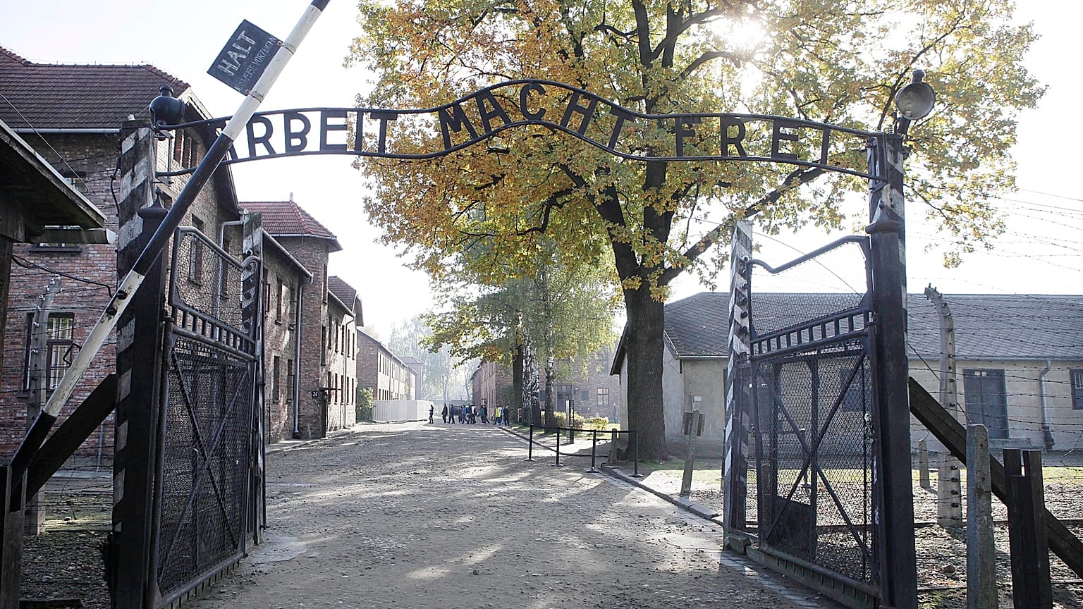 FILE - This Oct. 19, 2012 file photo shows the entrance of Auschwitz at the former Nazi German death complex of Auschwitz-Birkenau in in Oswiecim, Poland.