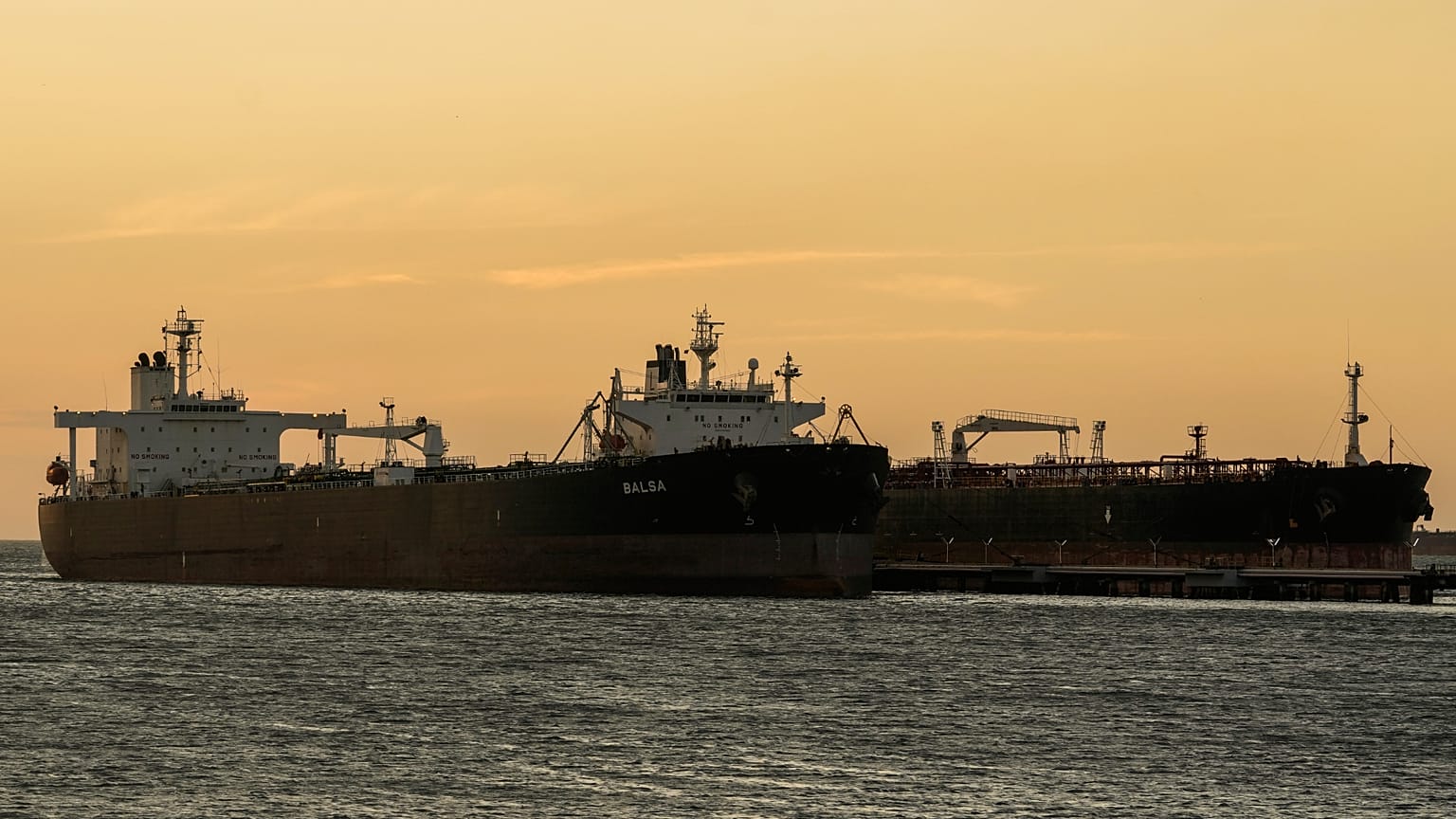 Oil tankers are docked at the Cardon refinery at sunset in Punta Cardon, Venezuela. 14 Jan 2026.
