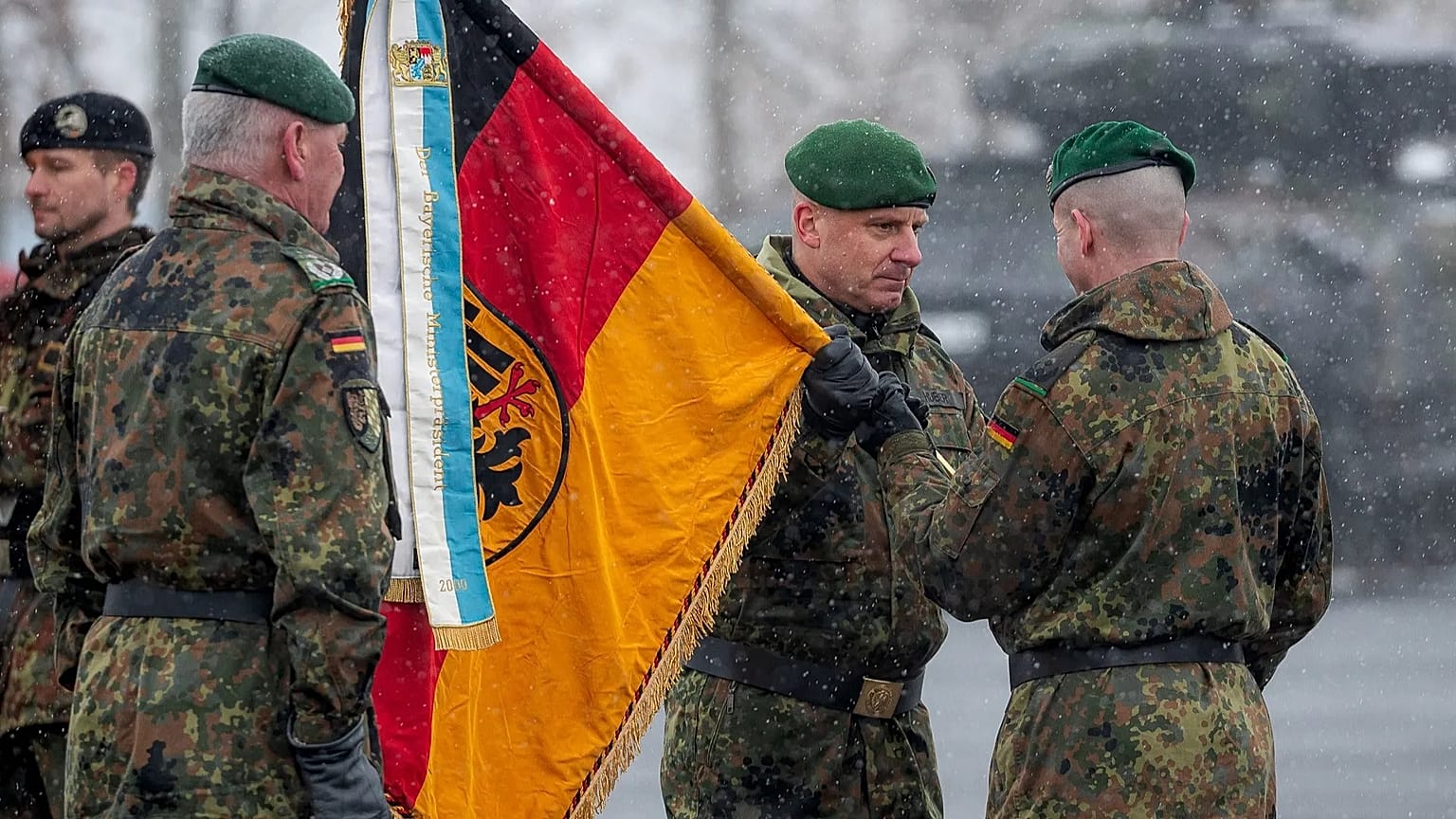 Brigadier General Christoph Huber commander of Armoured Brigade 45 "Lithuania" hands over the troop flag to Lieutenant Colonel Rayk Engel