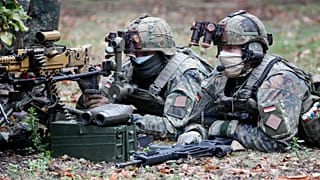 Soldiers demonstrate their skills during the visit of German President Frank-Walter Steinmeier at the German/Netherlands Corps in Muenster, Germany, on Tuesday, Sept. 29, 2020