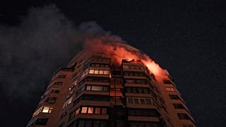 Emergency services personnel work to extinguish a fire at a multi-storey apartment building following a Russian attack in Kyiv, 3 February 2026
