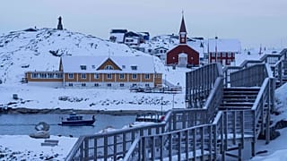 A boat travels at the sea inlet in Nuuk, Greenland, on Tuesday, Jan. 13, 2026.
