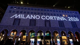 Olympic rings are projected on the facade of a building in front of the Duomo gothic cathedral, in Milan, Italy, Wednesday, Jan. 28, 2026. (AP Photo/Luca Bruno)