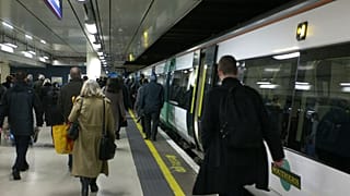 FILE. Passengers arrive at Victoria railway station in London. 2 Jan. 2014.