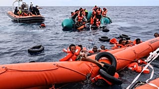 Migrants aboard a rubber boat in waters off Libya before being rescued by a team of the Sea Watch-3, 18 October, 2021