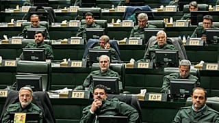  Iranian lawmakers attend a session of parliament as they wear the Revolutionary Guard's uniform, in Tehran, 1 February 2026
