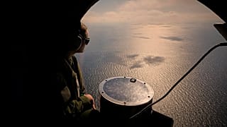 A crew member of a French Navy Atlantique-2 submarine hunter naval airplane near the Black Sea port of Constanta, 9 April, 2025