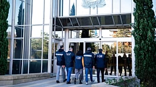 FILE: Italian carabinieri and police officers arrive at the Interpol headquarters in Lyon, 2 February 2023