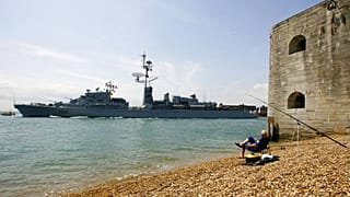 FILE: A fisherman watches the French destroyer De Grasse leave Portsmouth harbor in southern England for operation FRUKUS, 27 June 2006