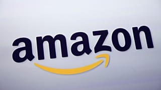 FILE - The Amazon logo is displayed at a news conference in New York on Sept. 28, 2011