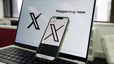 FILE: The opening page of X is displayed on a computer and phone, 16 October 2023 in Sydney. 